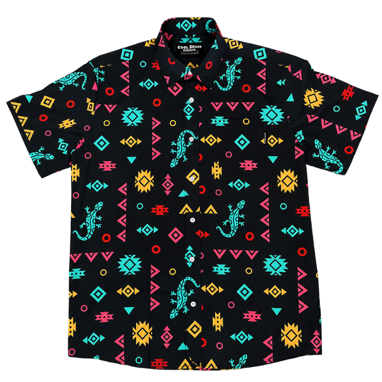 A short-sleeve button-up shirt with a black base and a vibrant, all-over Southwestern geometric pattern featuring turquoise, yellow, pink, and orange shapes, including lizard motifs.  It is a reference to the Phish song Lizards.